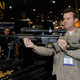 A man demonstrates an AR-15 rifle with a silencer at a trade show in Las Vegas on Jan. 18, 2011. (Ethan Miller/Getty Images)